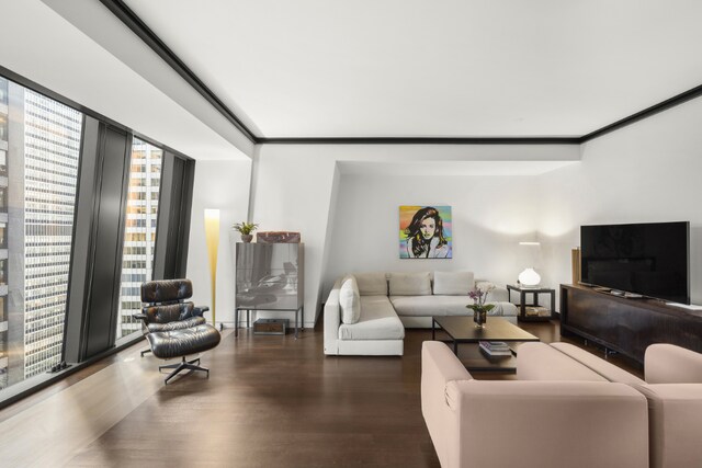 living room featuring hardwood / wood-style flooring and a wall of windows