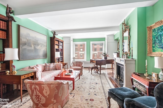 living room featuring crown molding and light hardwood / wood-style flooring