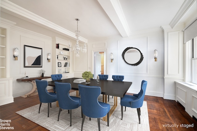 dining space with a decorative wall, built in features, beamed ceiling, and ornamental molding