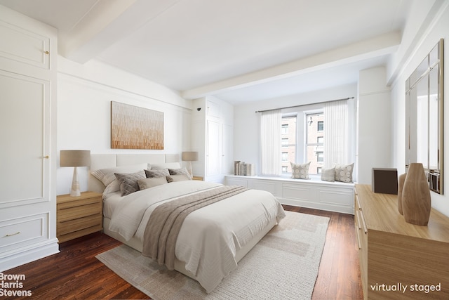 bedroom featuring dark wood-type flooring and beamed ceiling