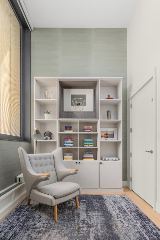 sitting room with hardwood / wood-style floors