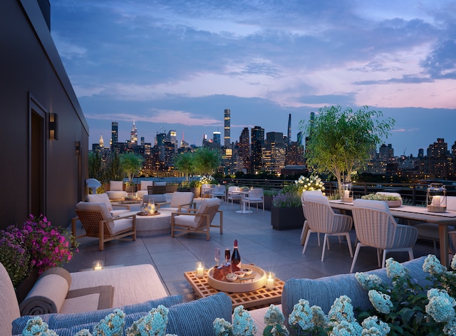 11-32 31st Ave Unit 5C, New York City, NY 11106 - view of patio featuring a skyline view and an outdoor living space with a fire pit