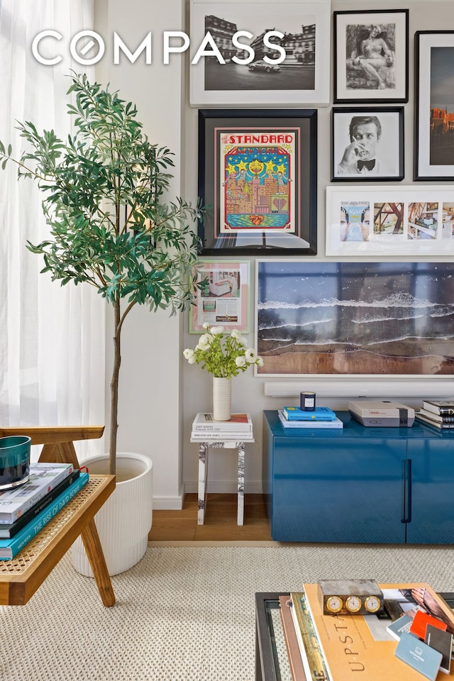 interior space with baseboards and wood finished floors