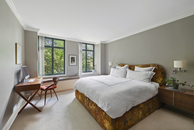 bedroom featuring crown molding and light carpet