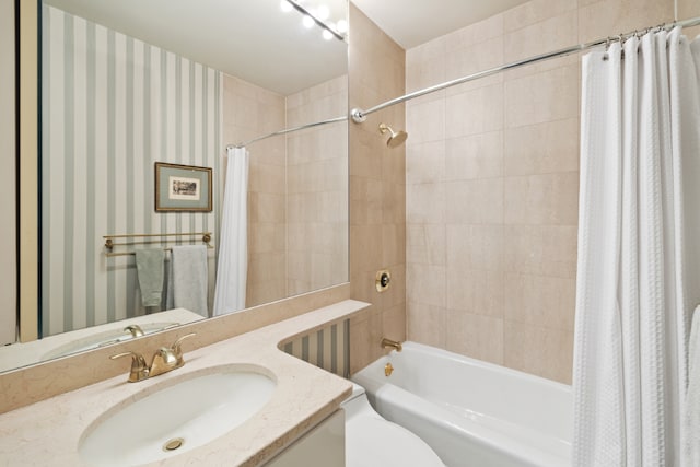 full bathroom featuring toilet, vanity, and shower / tub combo with curtain