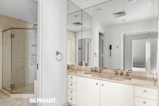 2 E 61st St Unit 1001/1003, New York City, NY 10021 - bathroom with double vanity and a shower stall