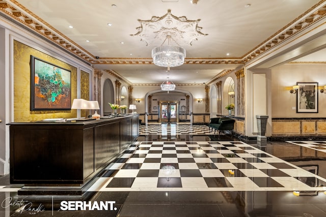 2 E 61st St Unit 1001/1003, New York City, NY 10021 - welcome area with arched walkways, crown molding, a chandelier, and recessed lighting