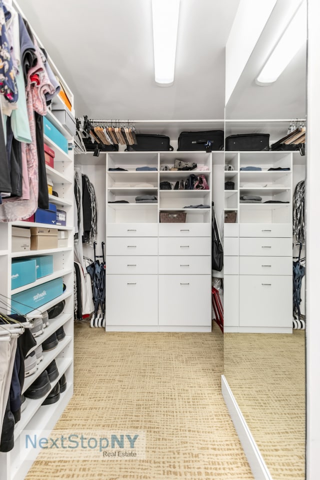 spacious closet featuring tile patterned floors