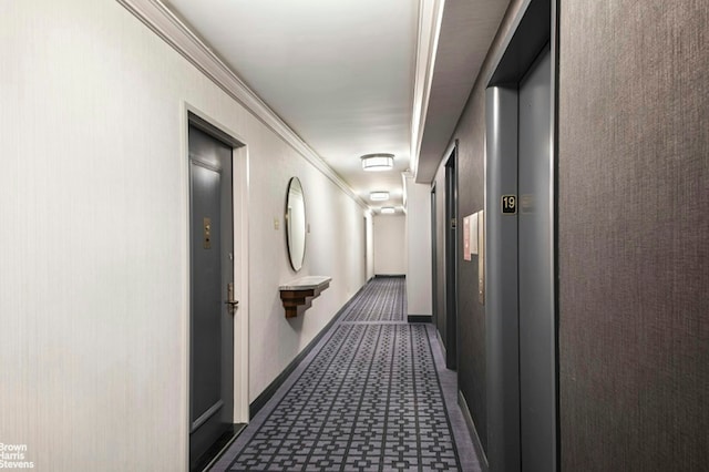 345 E 80th St Unit 19Ef, New York City, NY 10028 - corridor with baseboards, tile patterned floors, crown molding, and elevator