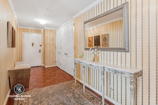 hall with ornamental molding and wallpapered walls