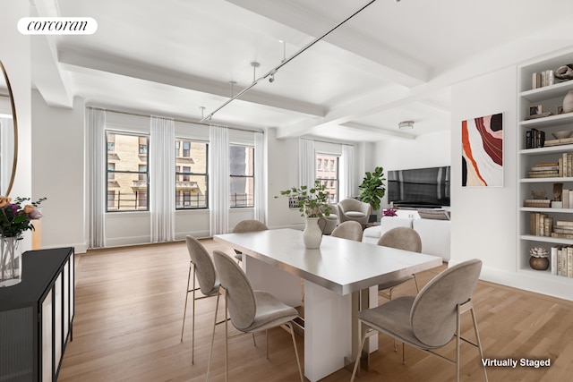 dining space with light hardwood / wood-style floors and built in shelves