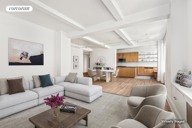 living room with light hardwood / wood-style floors, beamed ceiling, and coffered ceiling