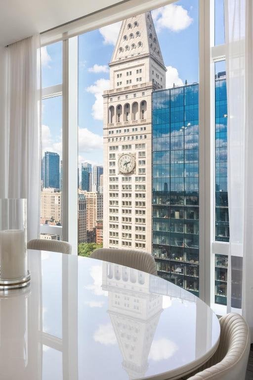 entryway with floor to ceiling windows