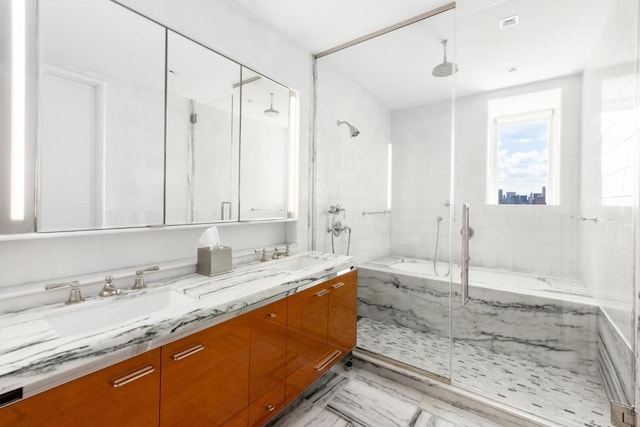 bathroom with independent shower and bath and vanity