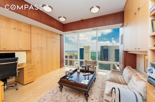 641 5th Ave Unit 49Cde, New York City, NY 10022 - living area featuring light wood-type flooring, an office area, and a city view