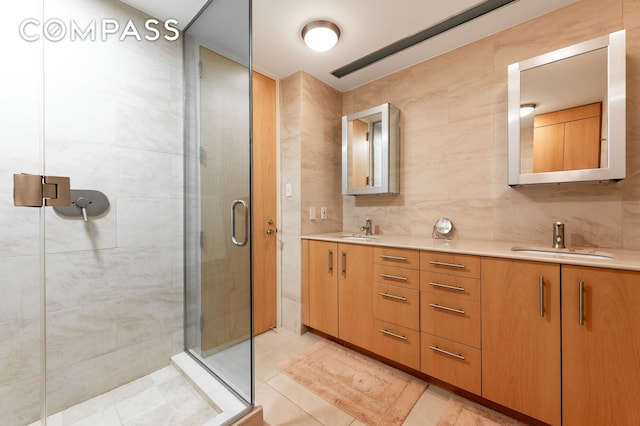 641 5th Ave Unit 49Cde, New York City, NY 10022 - bathroom with double vanity, a stall shower, tile patterned flooring, and tasteful backsplash