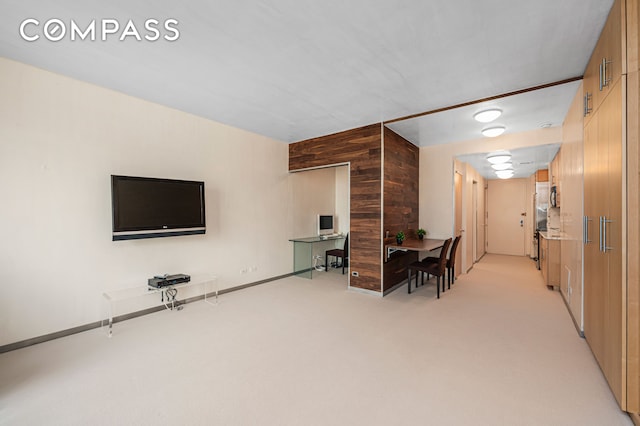641 5th Ave Unit 49Cde, New York City, NY 10022 - home office featuring wooden walls and light carpet