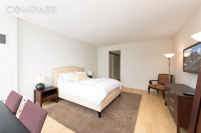 641 5th Ave Unit 49Cde, New York City, NY 10022 - bedroom featuring light wood-style flooring