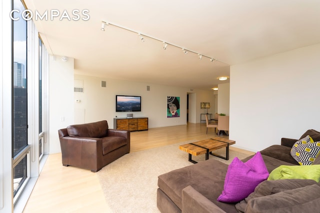 641 5th Ave Unit 49Cde, New York City, NY 10022 - living area with rail lighting and light wood finished floors