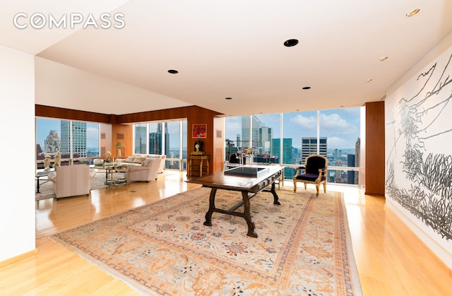 641 5th Ave Unit 49Cde, New York City, NY 10022 - office with a view of city, wood finished floors, and recessed lighting