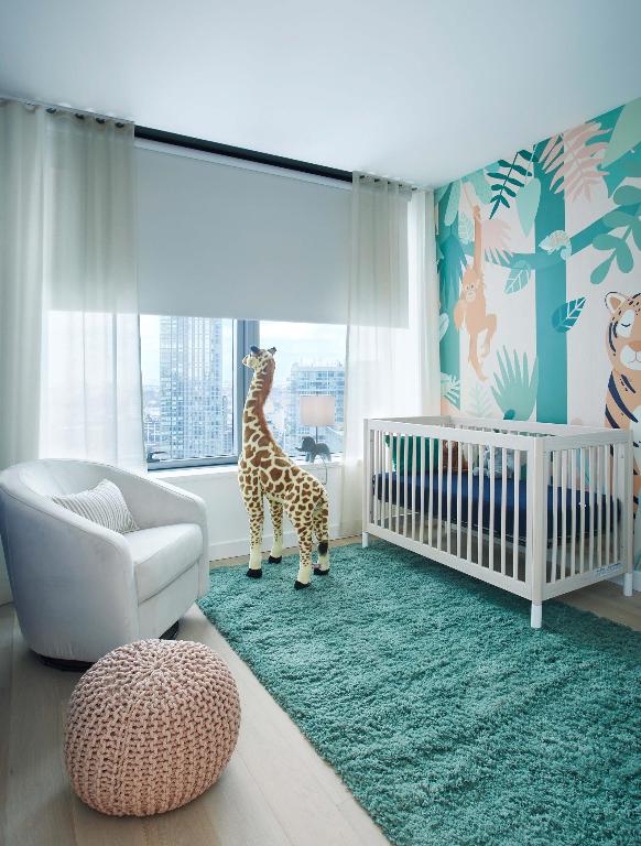 bedroom with a nursery area