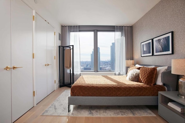 bedroom with light wood-type flooring