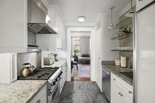 kitchen with white cabinetry, stainless steel appliances, wall chimney exhaust hood, and ornamental molding