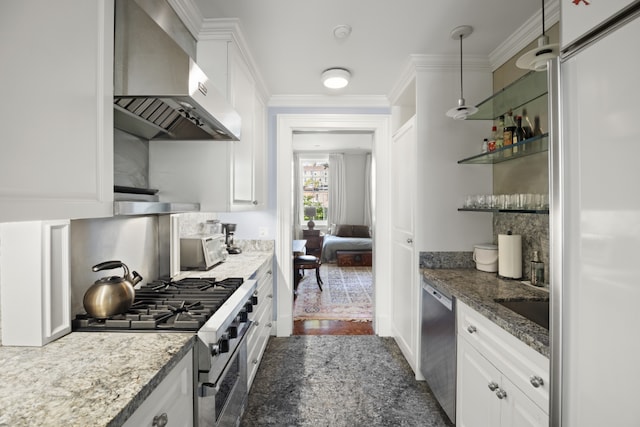 kitchen with white cabinetry, wall chimney range hood, light stone countertops, and appliances with stainless steel finishes