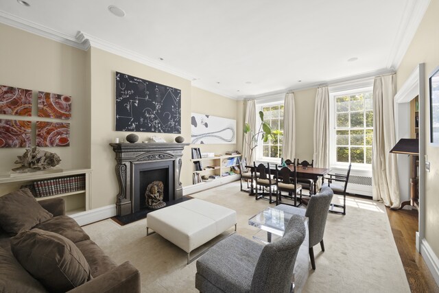 26 Washington Sq N, New York City, NY 10011 - living area with ornamental molding, a fireplace, and wood finished floors