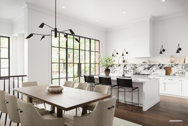 dining room featuring crown molding, dark hardwood / wood-style floors, a chandelier, and sink