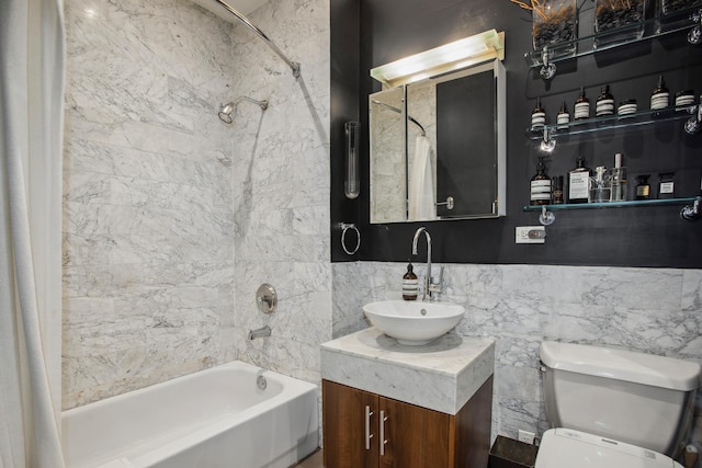 bathroom with shower / tub combo, vanity, toilet, and tile walls