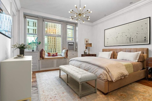 bedroom with multiple windows, crown molding, and a notable chandelier