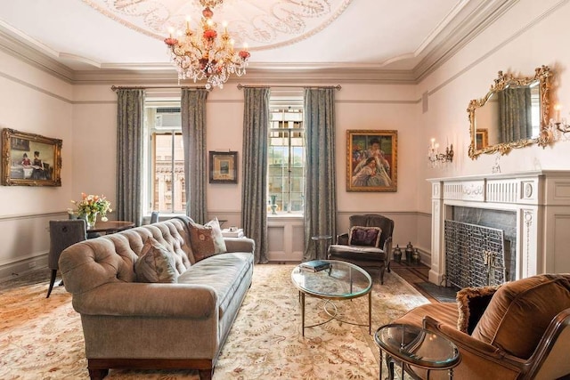 sitting room featuring crown molding and an inviting chandelier