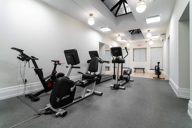 exercise room featuring a wall unit AC