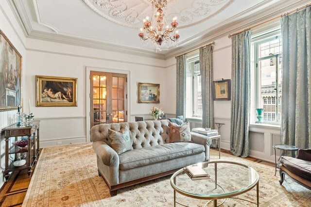 bedroom with ornamental molding and a chandelier