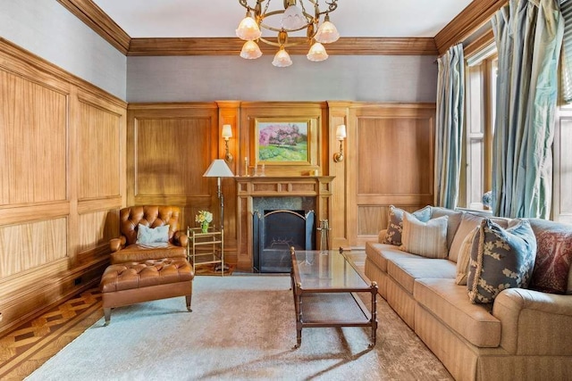 sitting room featuring crown molding, a premium fireplace, an inviting chandelier, wooden walls, and light parquet flooring