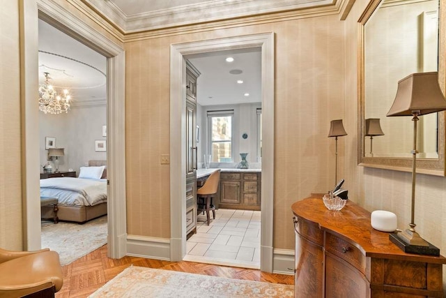 hallway featuring light parquet flooring, a notable chandelier, and crown molding