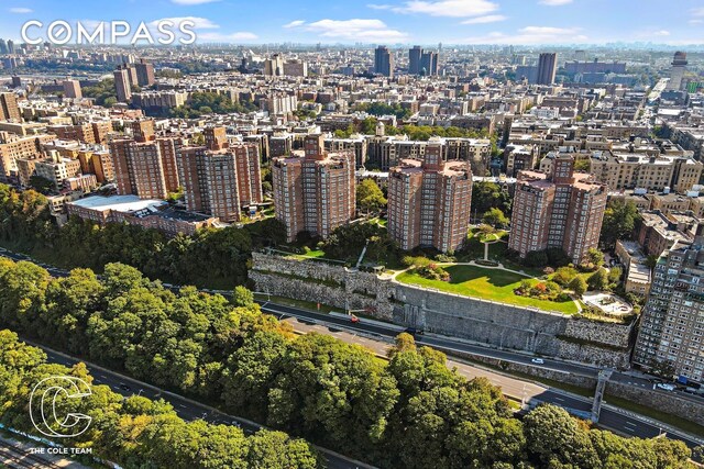 birds eye view of property with a view of city