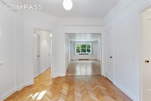 corridor with light parquet flooring