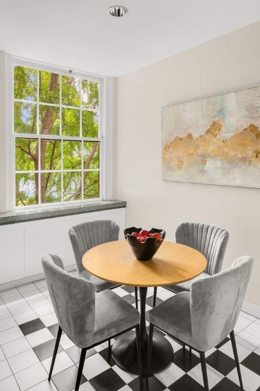 tiled dining space featuring breakfast area