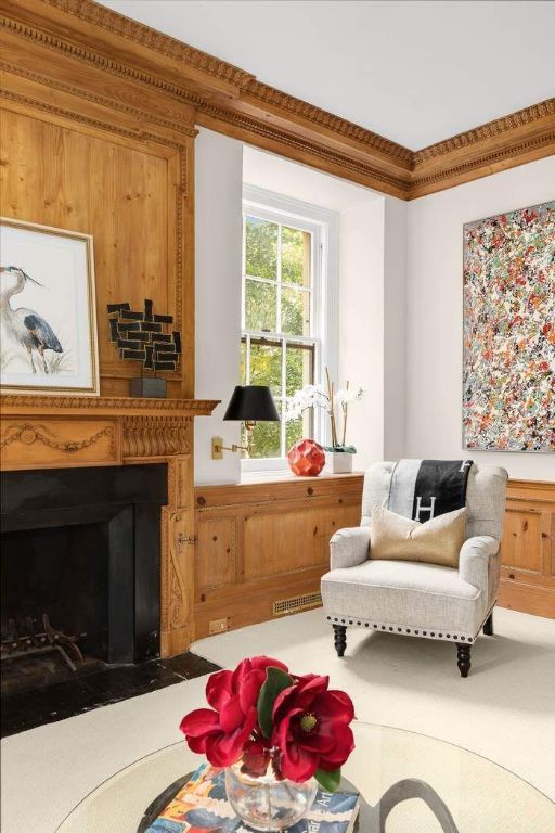 living area with ornamental molding and light parquet flooring