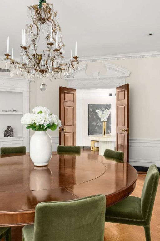 dining area featuring built in features and ornamental molding