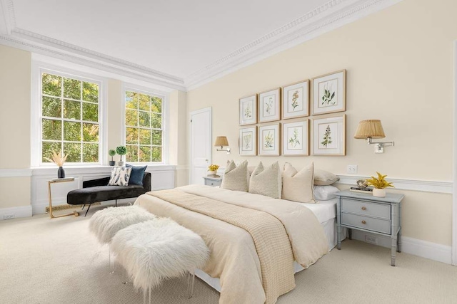 carpeted bedroom featuring crown molding