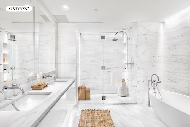 bathroom with a sink, a marble finish shower, a soaking tub, and double vanity