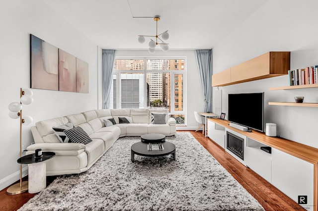 living room featuring baseboards and wood finished floors