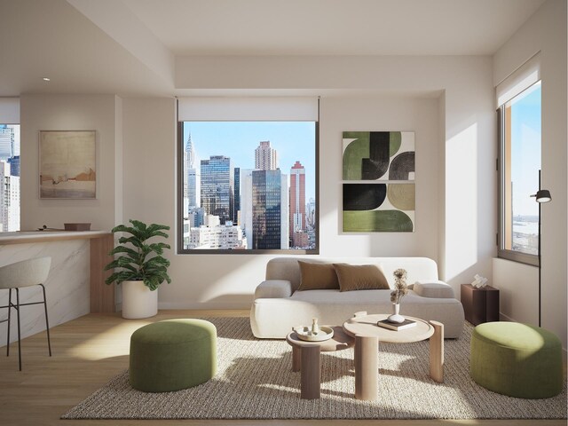 living area with a view of city and wood finished floors