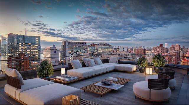 exterior space with a city view, a balcony, and an outdoor hangout area