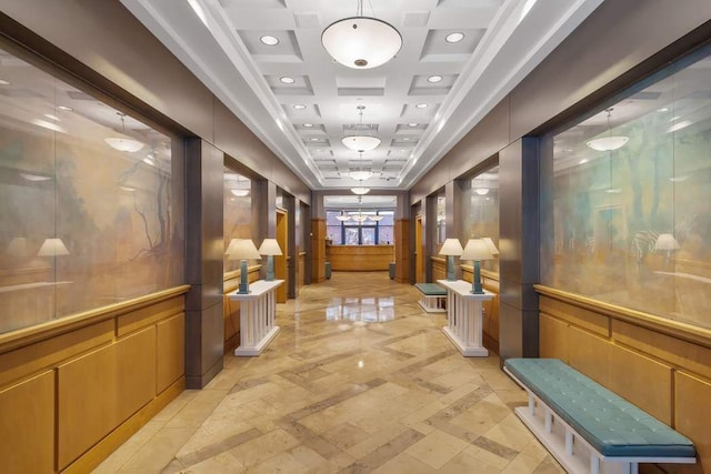 corridor featuring beamed ceiling and coffered ceiling