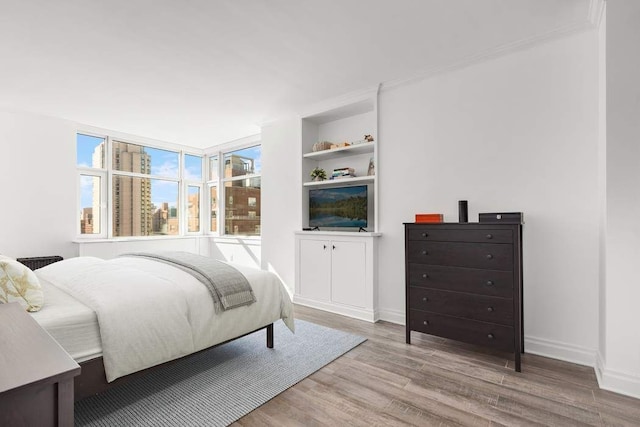 bedroom with light wood-type flooring