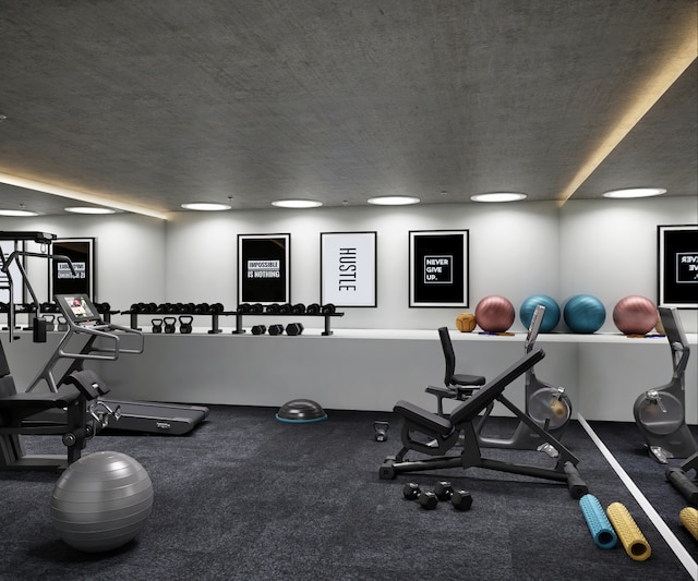 exercise room with a textured ceiling